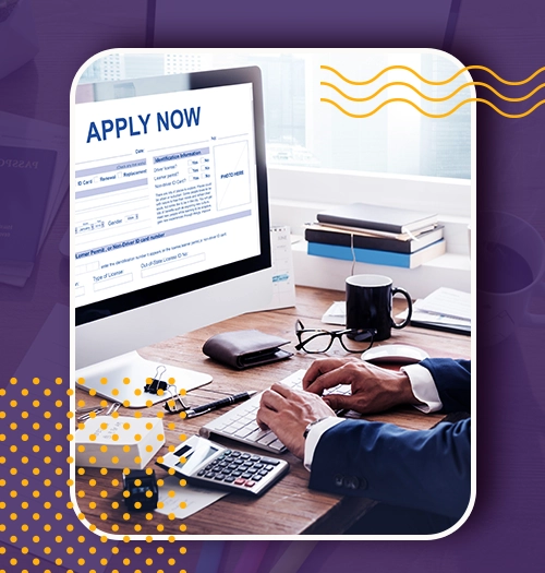 Person at a desk filling out an online study abroad application form on a desktop showing Apply Now
