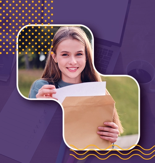 Smiling student holding an envelope after receiving a university offer letter to study abroad