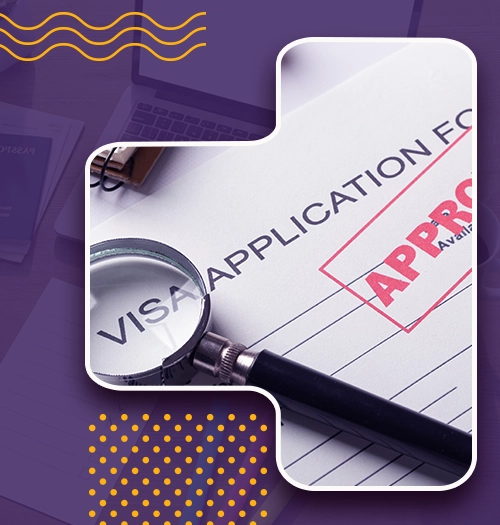 Magnifying glass over a visa application form stamped Approved for studying abroad